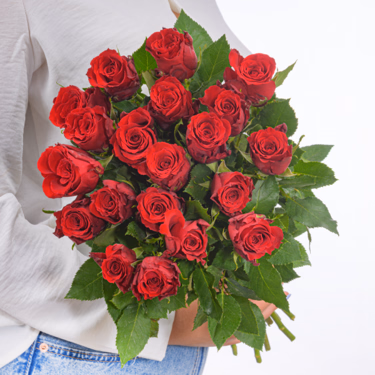 Red Fairtrade roses in a bunch with vase