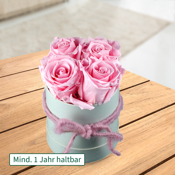 4 rosa haltbare Rosen in Hutschachtel