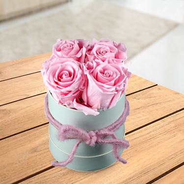 4 light pink roses in a hat box