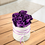 4 purple roses in a hat box