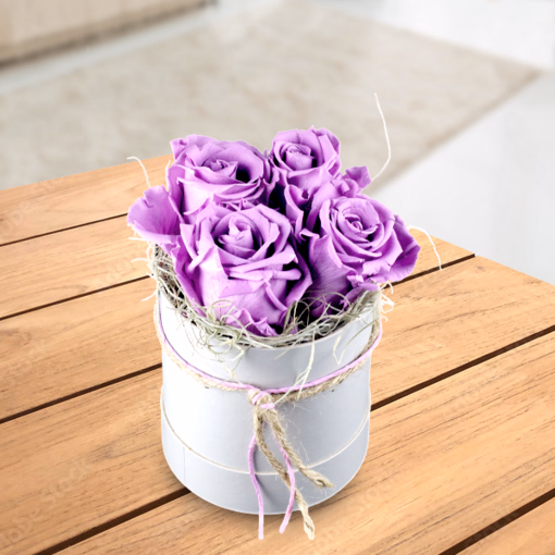 4 lilac roses in a hat box