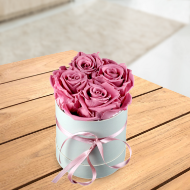 4 old pink roses in a hat box